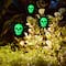 Glitzhome® 24" Halloween Metal Sunflower Skulls Glow-in-Dark Yard Stakes, 3ct.